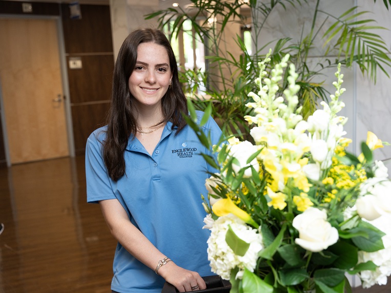 Hospital volunteer with flowers