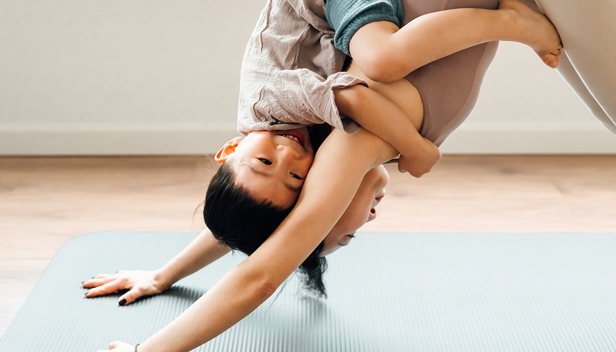 Mother and child doing yoga