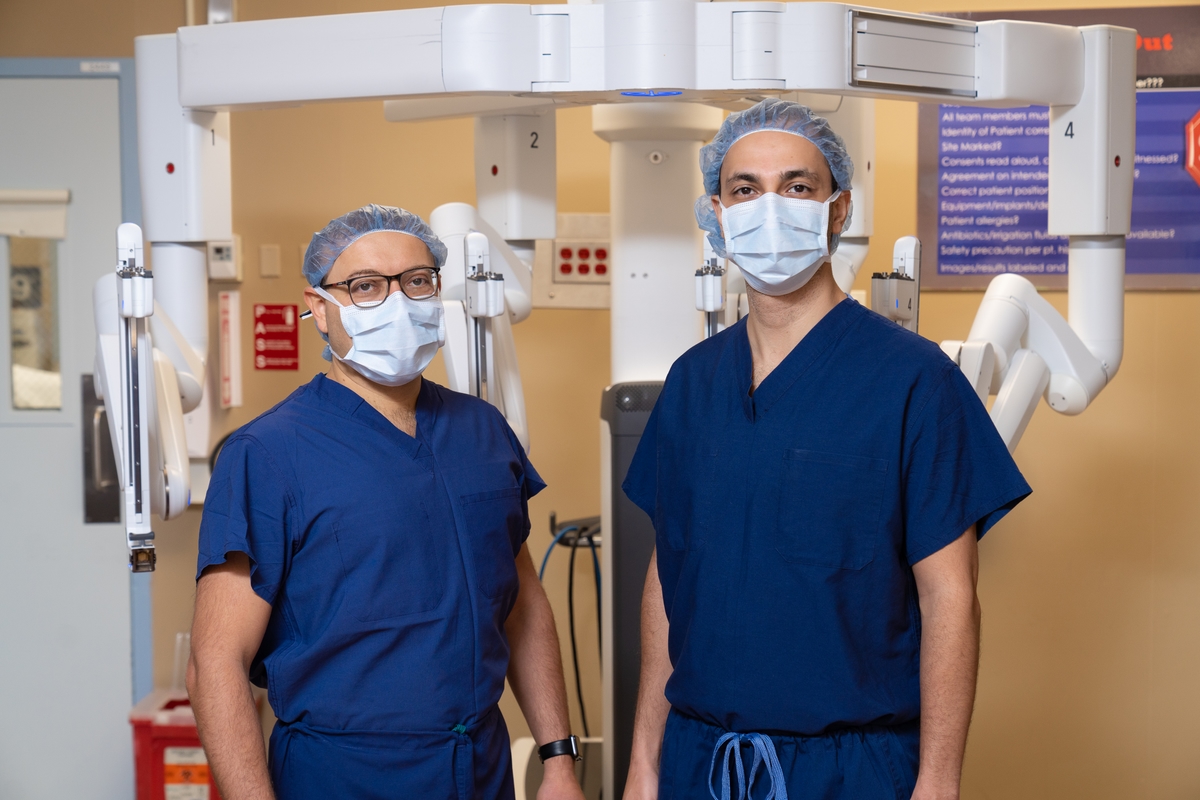 Two doctors with a robotic bronchoscopy device