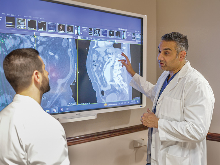Two doctors taking
